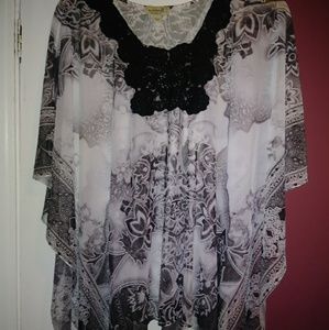 Black and white sheer puncho style top